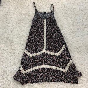 A short flowy dress with pink flowers has no stains or rips.